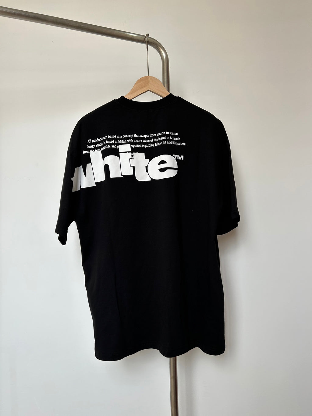 Off White T-shirt back with small quote text and large white 'white' graphic