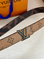 Louis Vuitton monogram belt buckle close-up with gold-tone LV and blue enamel