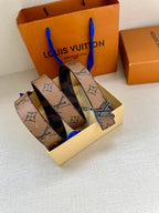 Louis Vuitton monogram belt set with gold-tone LV buckle and dark patterned straps