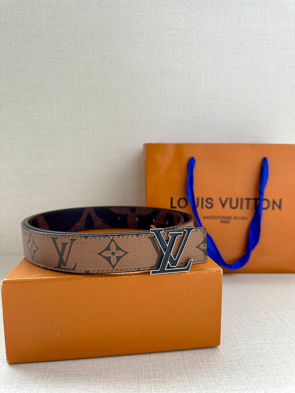 Louis Vuitton monogram belt with gold-tone LV buckle and blue enamel on box