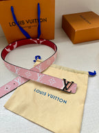 Pink monogram belt laid flat with silver LV buckle and pouch