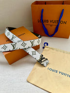 Louis Vuitton belt with white monogram strap, dark green trim, silver LV buckle