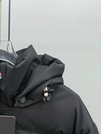 Black hooded puffer jacket shoulder and collar with buttons and snaps