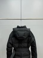 Black long puffer jacket back view with hood and waist belt