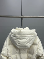 White long puffer jacket with hood, front zipper, and padded collar