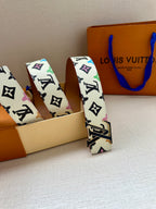 Leather LV monogram belt with gold buckle, two folded straps shown