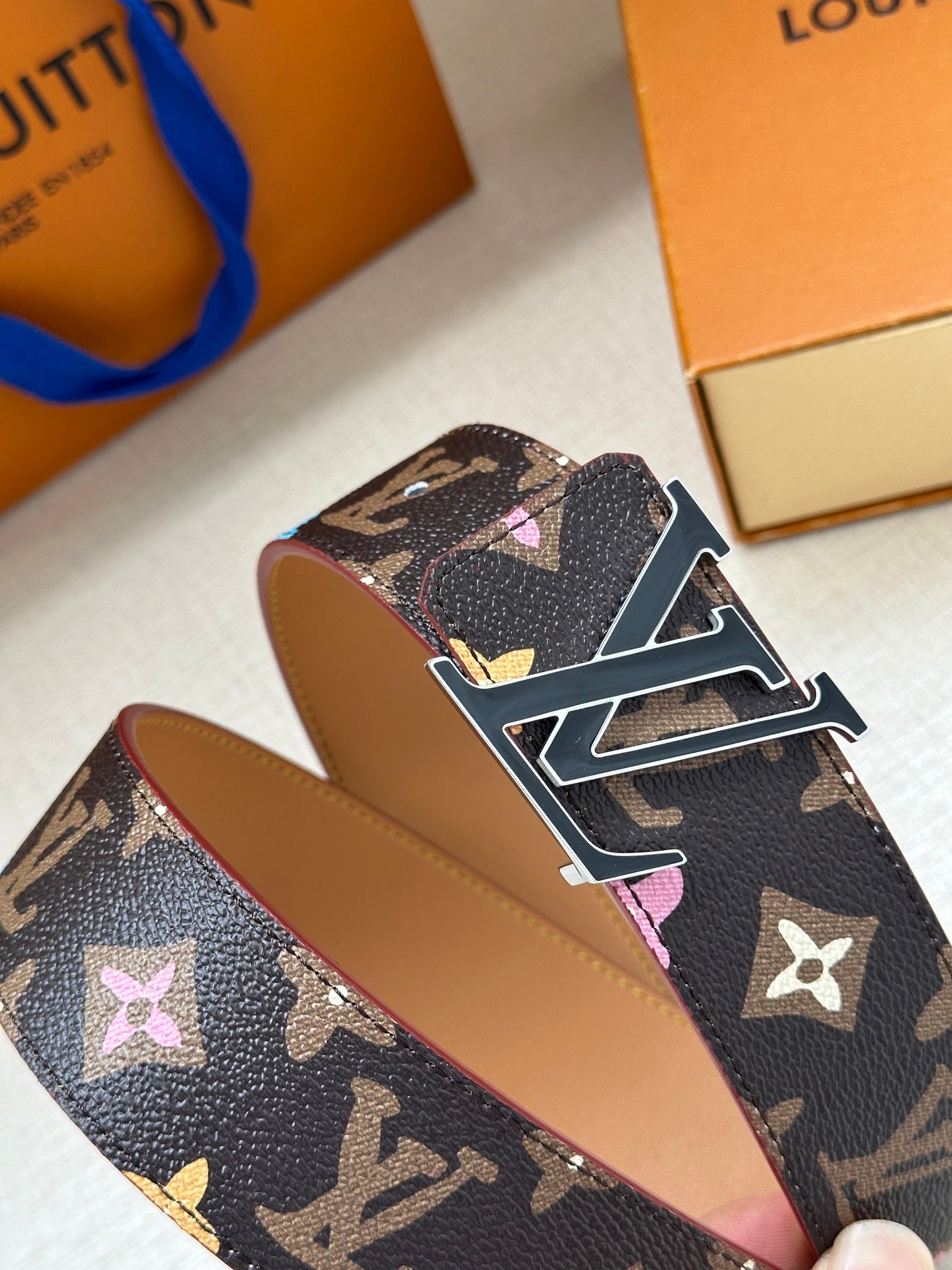 Navy monogram leather belt with multicolor flower motifs and silver LV buckle