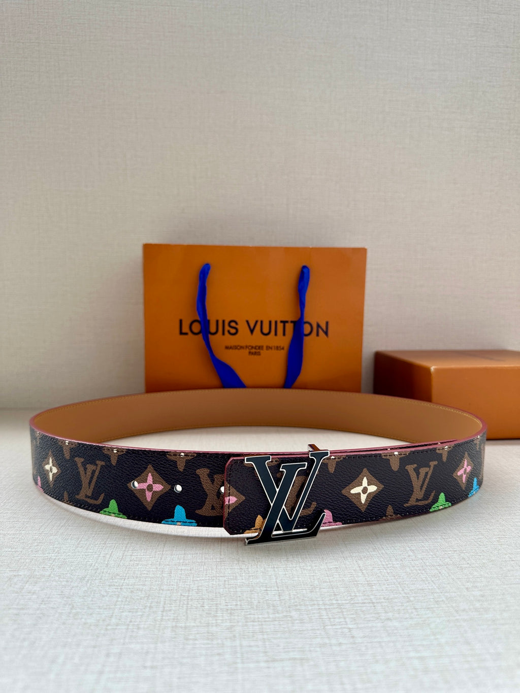 Louis Vuitton belt with navy monogram canvas, multicolor motifs, silver LV buckle