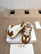 Dior unisex sneakers on white box, white laces and brown suede with cream sole.