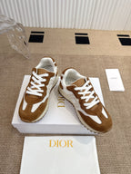 Dior unisex sneakers with brown suede uppers, white panels, and lace-up design.