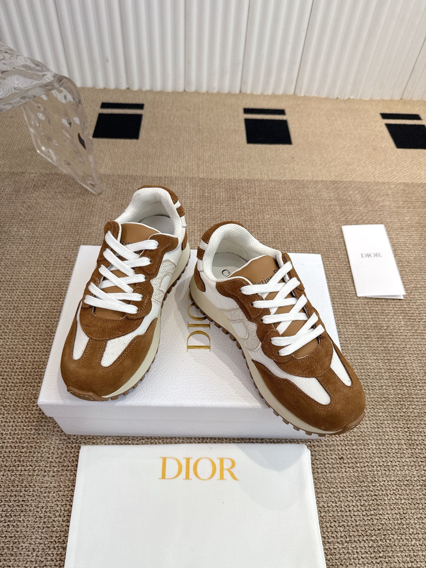 Dior unisex sneakers with brown suede uppers, white panels, and lace-up design.