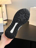 Rubber sneaker outsole with deep tread pattern and star center grip