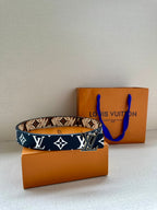 Louis Vuitton monogram belt, dark blue with white LV and star motifs across strap
