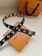 Louis Vuitton belt with dark blue strap and white LV monogram with star motifs