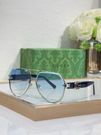 Gucci eyeglasses with silver metal frames and blue-tinted lenses
