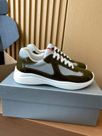 Prada unisex sneakers, olive green with white panel and red/black trim accents