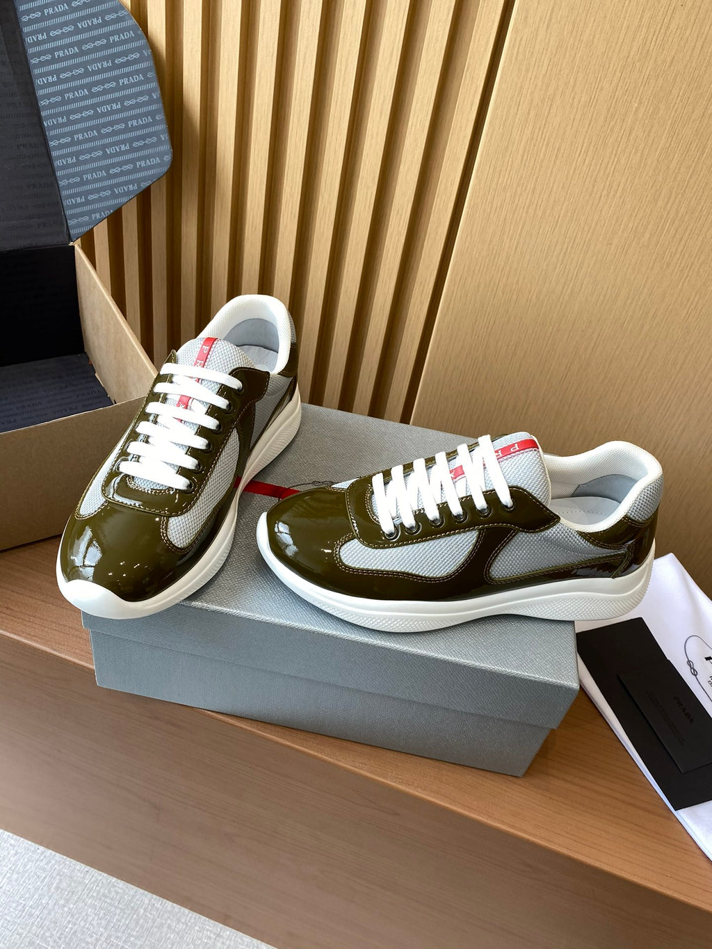 Prada unisex sneakers, olive green glossy uppers, white laces, chunky white sole