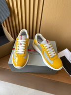 Prada unisex low-top sneakers, yellow and gray panels with white laces and trim