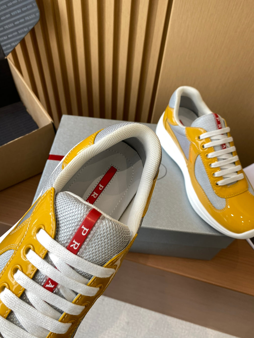 Prada unisex sneakers tongue and lace detail with red logo patch inside