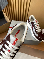 Sneaker heel and tongue with burgundy collar, white mesh upper, and red brand label