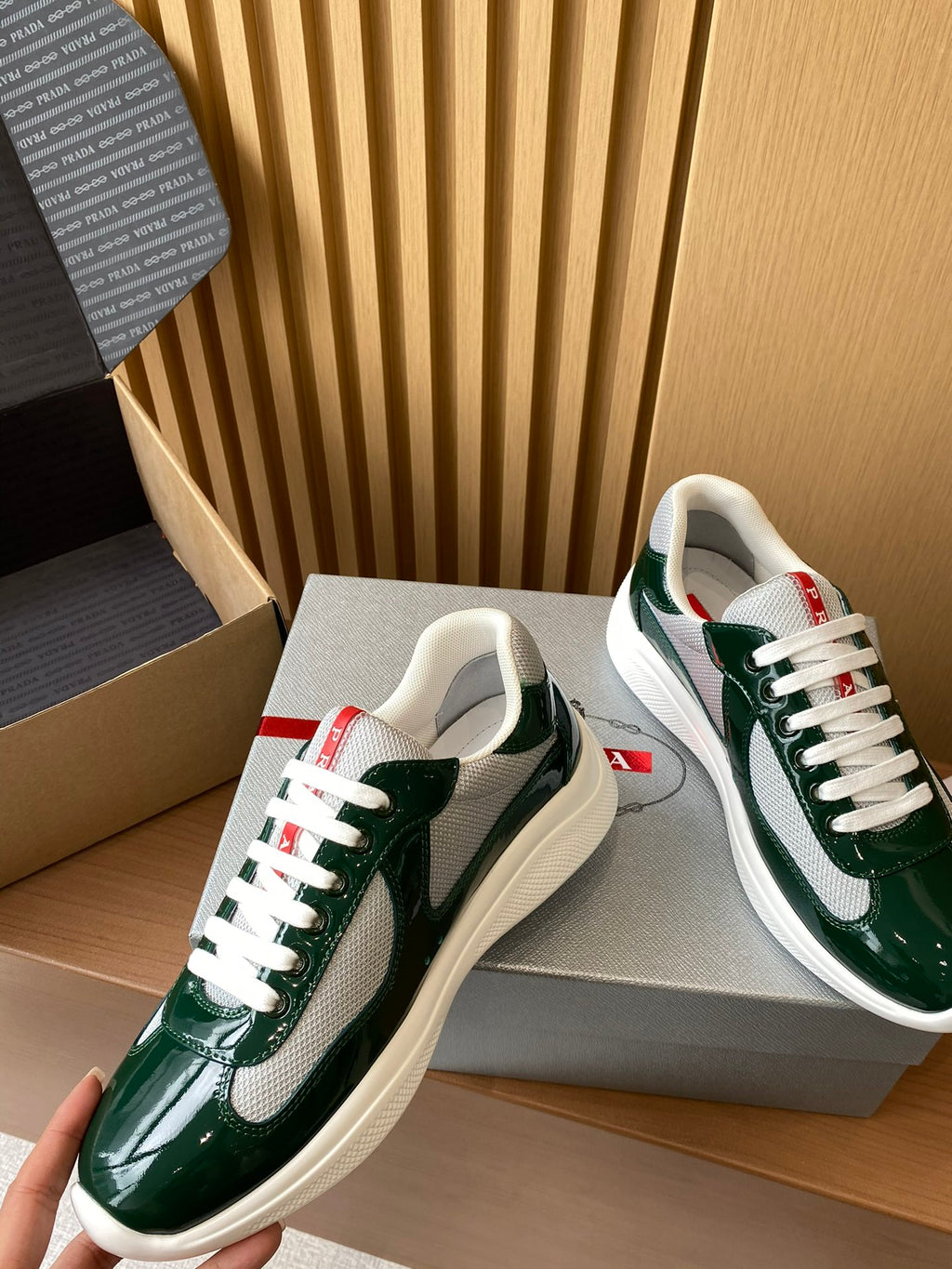 Prada unisex green patent sneakers with white laces and textured toe
