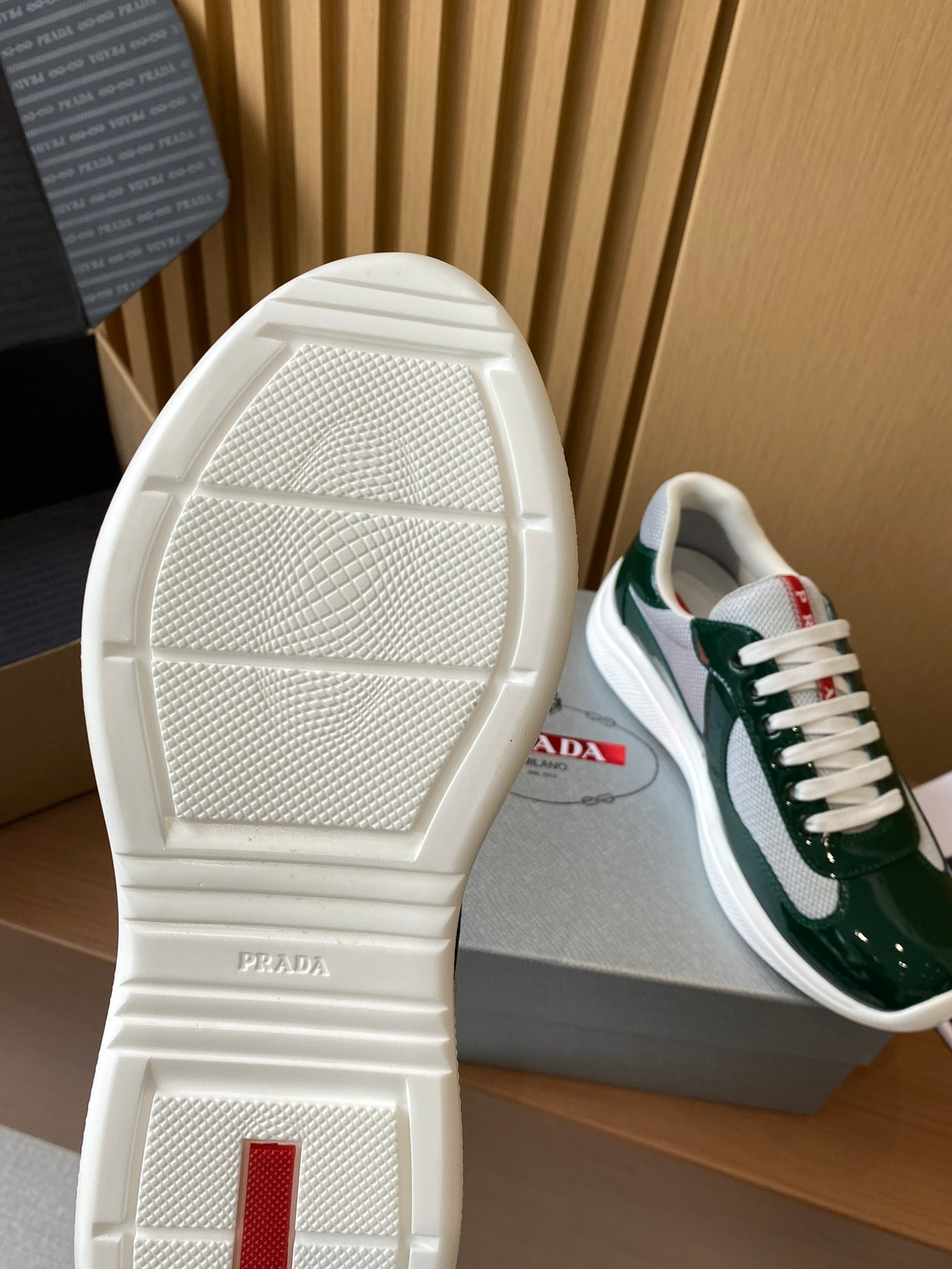 Prada unisex green sneakers outsole and toe, embossed brand on heel