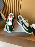 Prada unisex green sneakers with white laces and gray interior lining