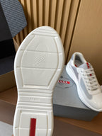 Prada unisex outsoles, textured tread with red vertical heel logo