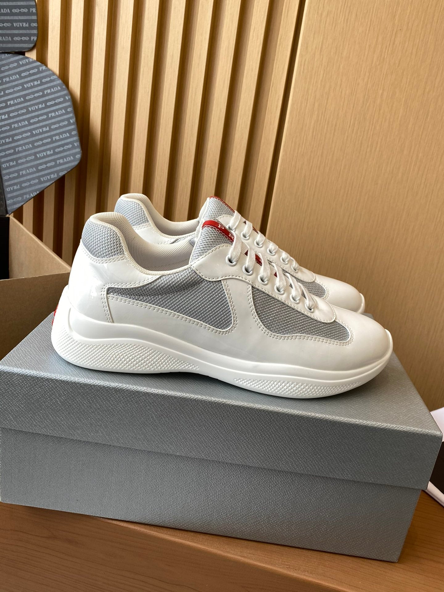 Prada unisex white and gray sneakers, mesh side panel, lace-up style