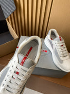 Prada unisex sneakers, white tongue strap with red detail, lace-up front