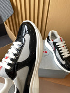 Prada unisex sneaker toe and side, black patent and grey mesh with white laces