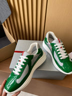 Prada unisex green patent sneakers, side view with white swoosh and white laces
