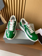 Prada unisex green patent sneakers with white laces and red heel tab