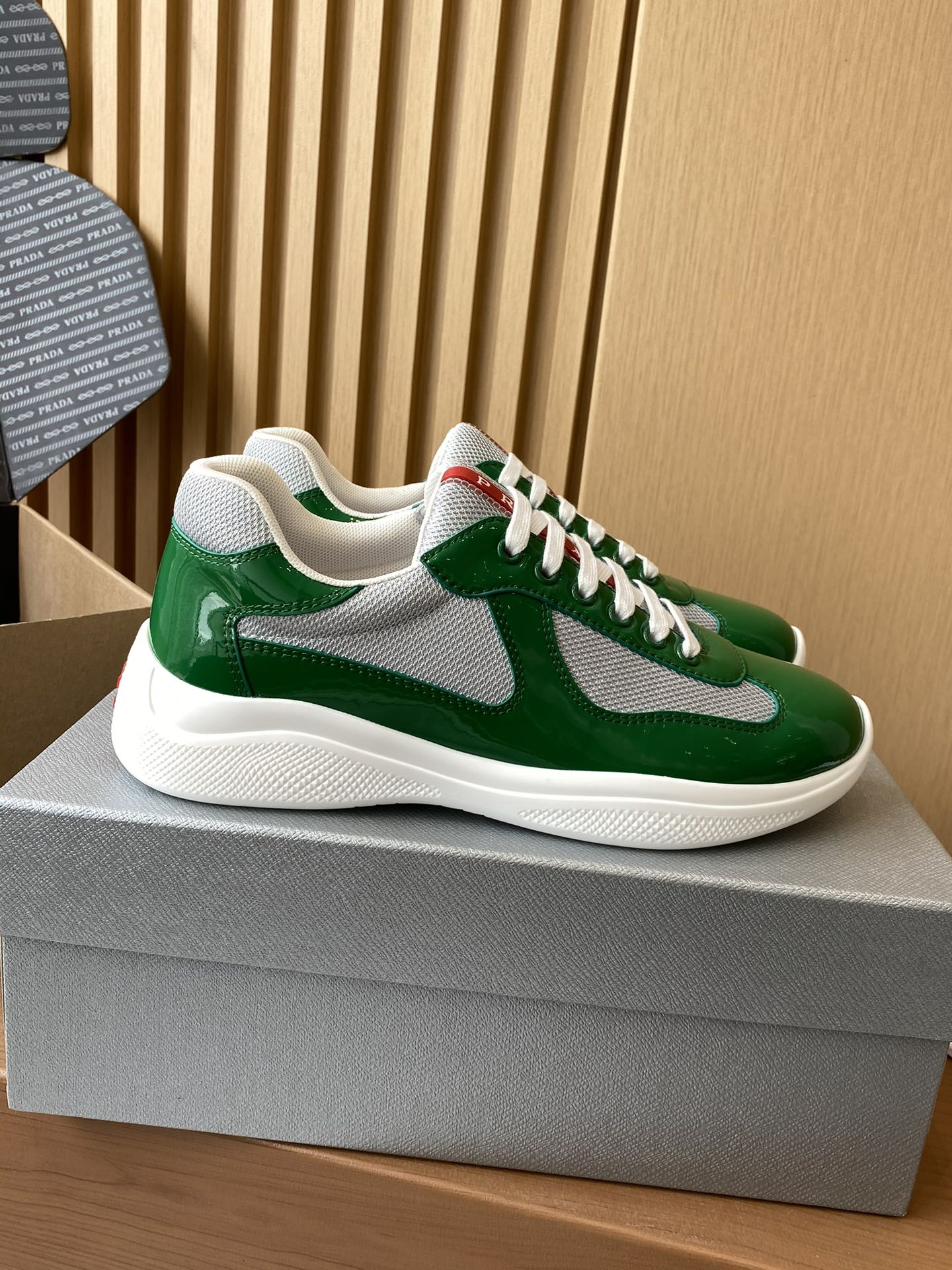 Prada unisex green sneakers with white swoosh and textured white sole