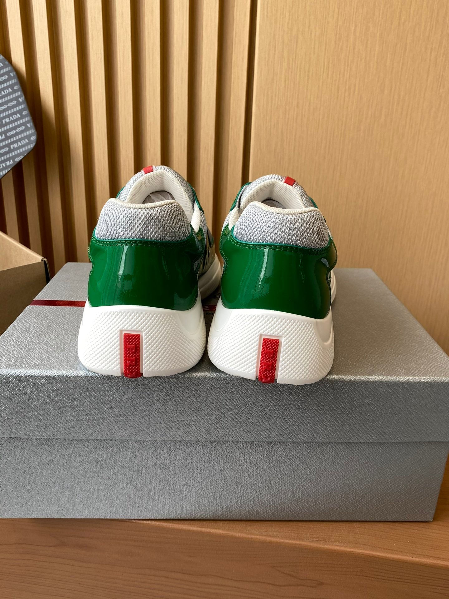Prada unisex green sneakers with white back heel tabs and cushioned collars