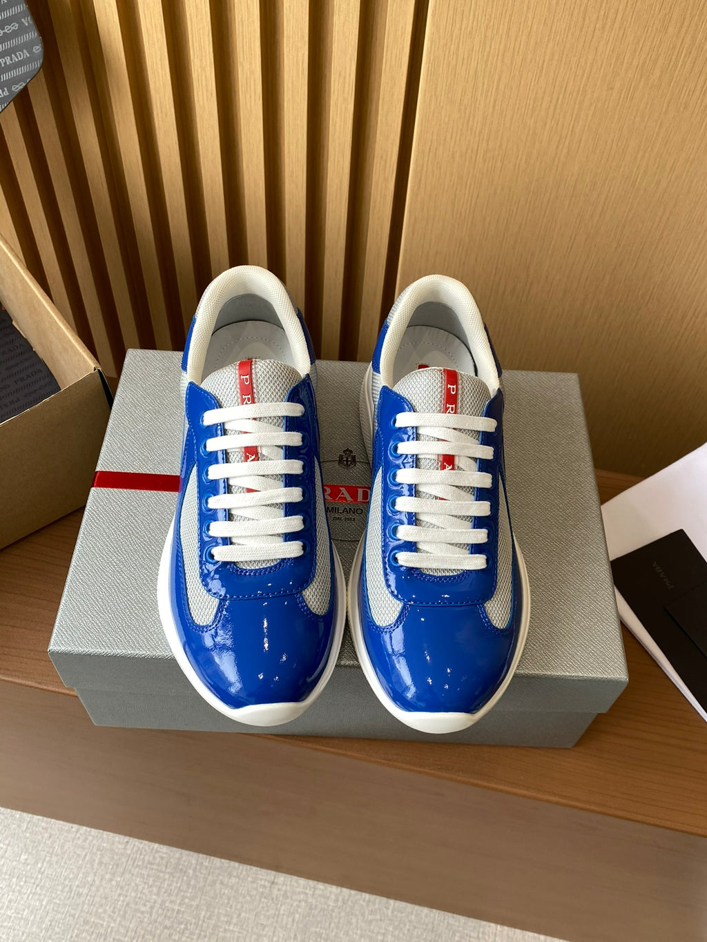 Prada unisex sneakers, blue leather with white laces and white rubber sole