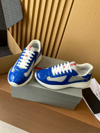 Prada unisex sneakers on box, blue leather, white laces, cushioned sole