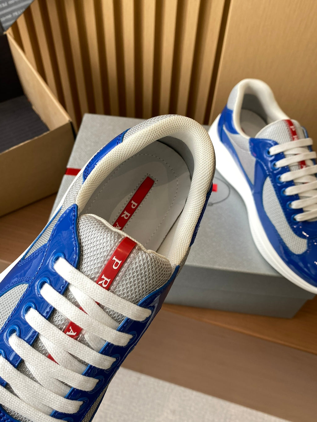 Prada unisex sneakers tongue and laces, blue leather with red label detail