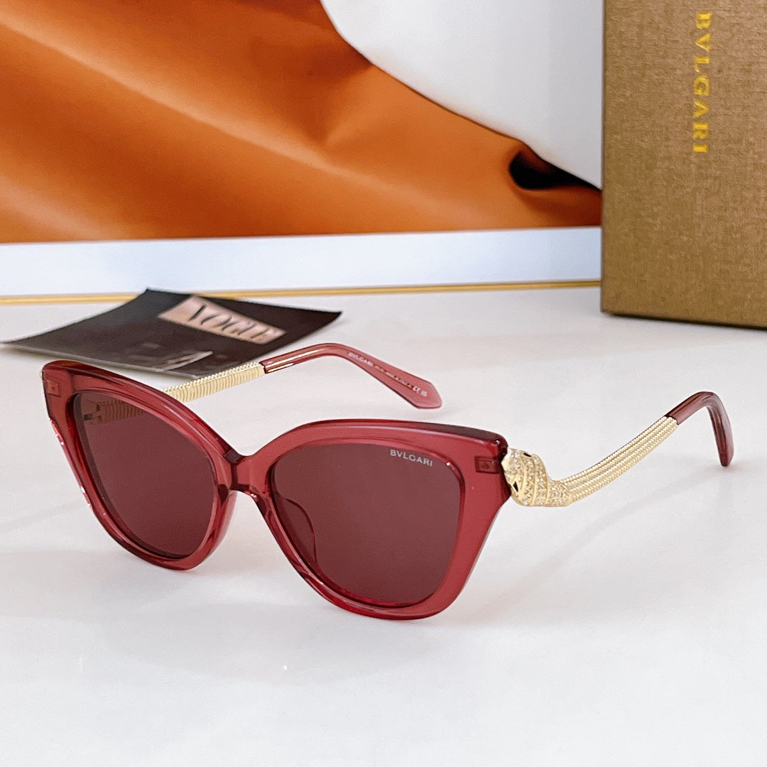 Bvlgari cat-eye sunglasses with red frames, gold chain temple details, burgundy lenses