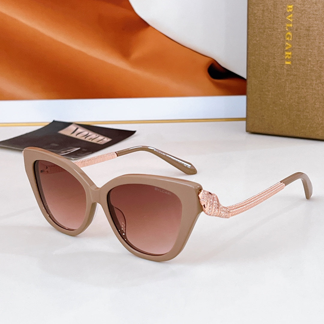 Bvlgari cat-eye sunglasses with beige frames, gold chain temple details, rose lenses