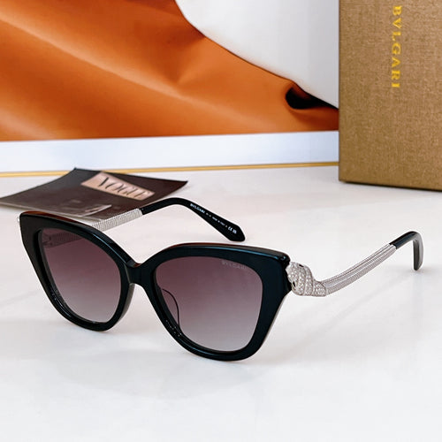 Bvlgari cat-eye sunglasses with black frames, gold chain temple details, dark lenses
