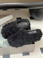 Black shaggy slide sandals in white box, rounded toe and gray insole