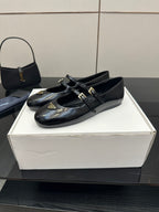 Prada women's black leather loafers with front strap buckles and low heel