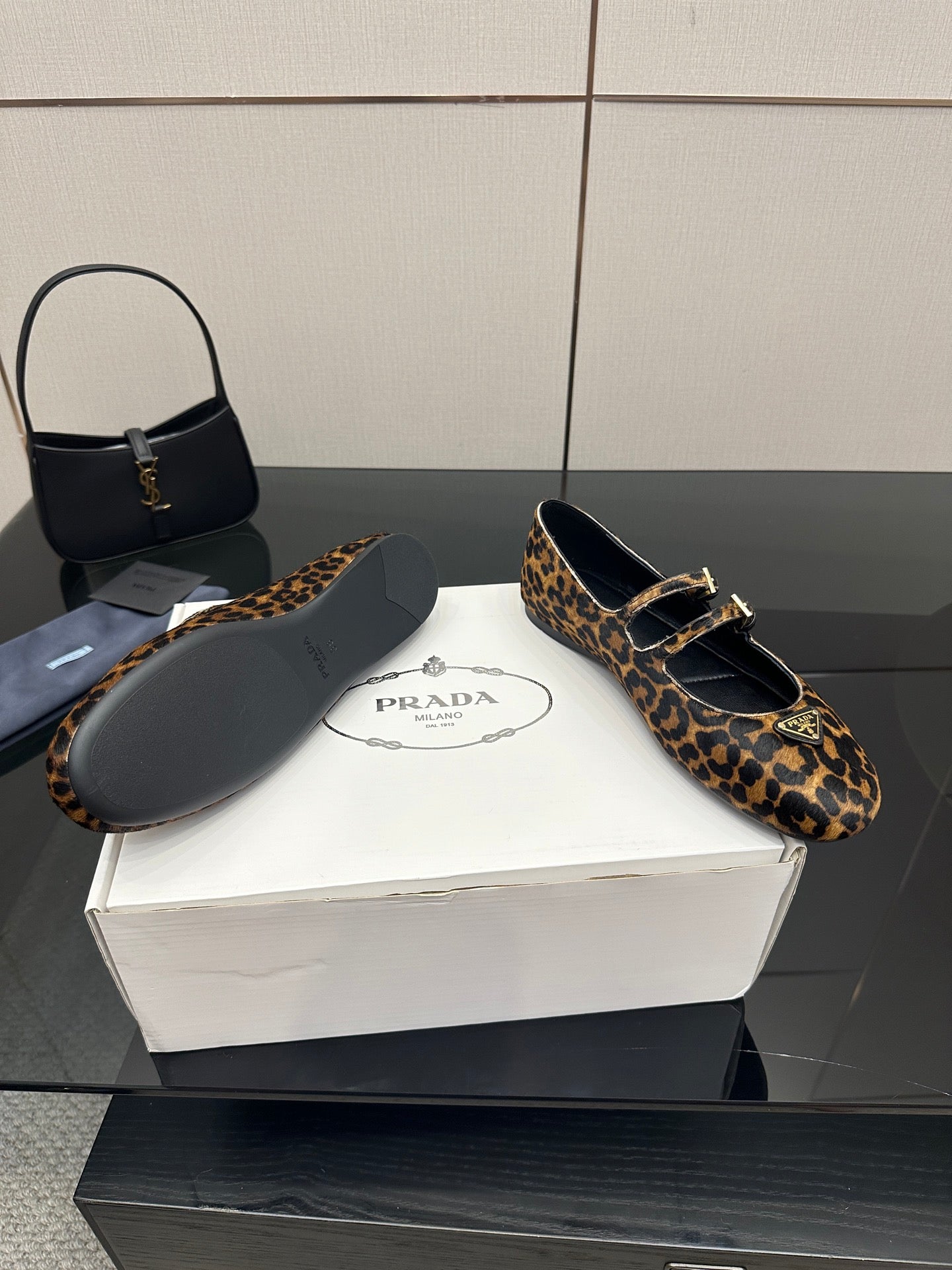 Prada leopard-print loafers with buckle strap and dark soles