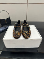 Prada ladies leopard-print flat loafers with black straps and gold-tone buckles