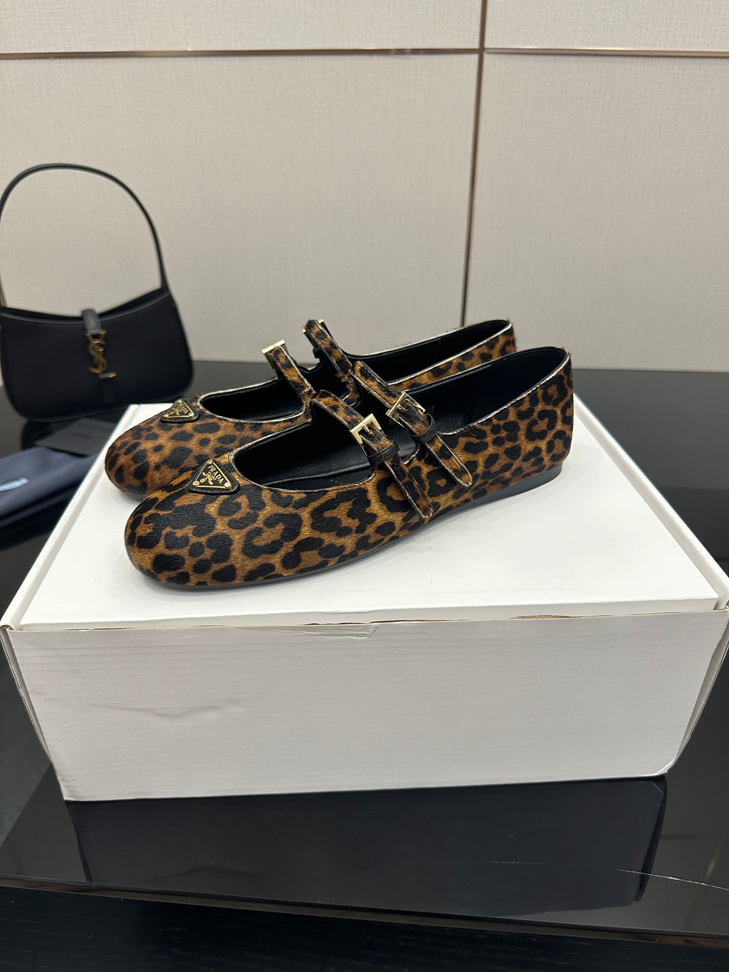 Prada leopard-print flat loafers with buckle strap and black interior lining