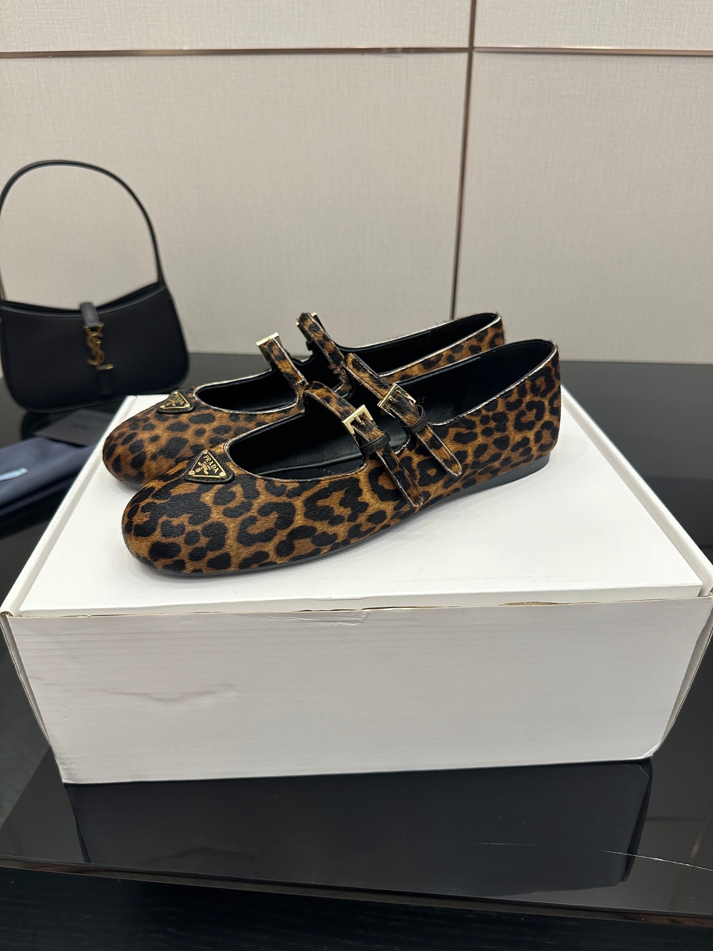 Prada leopard-print flat loafers with buckle strap and black interior lining