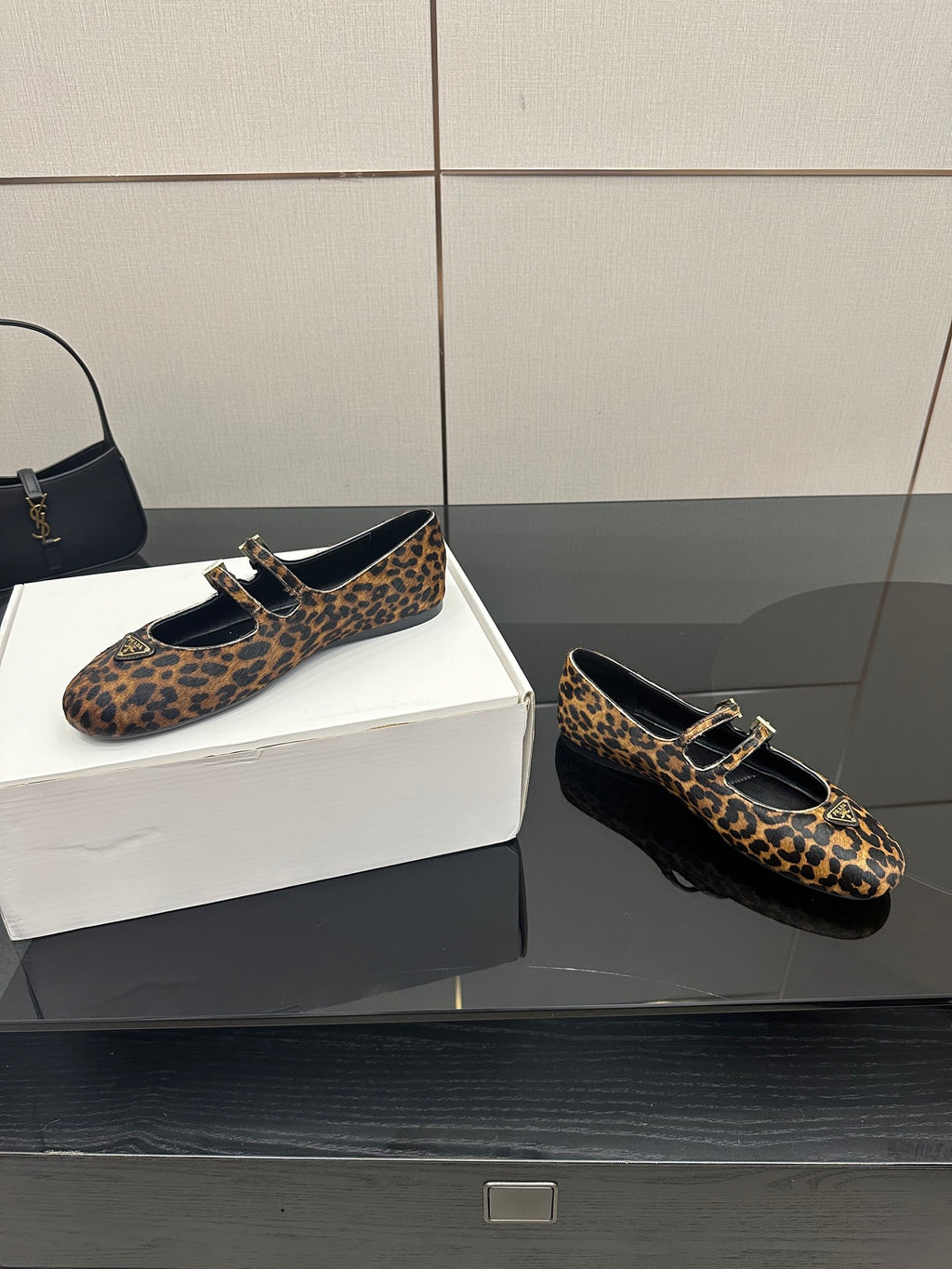 Prada leopard-print loafers, side view, gold-tone buckle and black strap