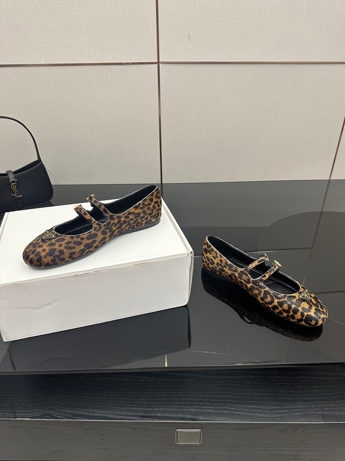 Prada leopard-print loafers, side view, gold-tone buckle and black strap