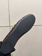 Prada leopard-print flat loafer outsole, dark rubber sole with Prada branding
